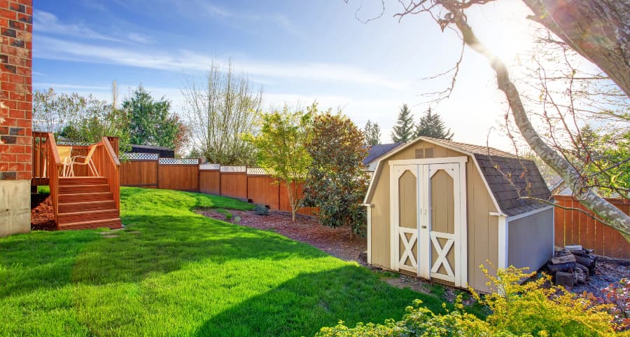 Fenced backyard with storage shed in Port St. Lucie